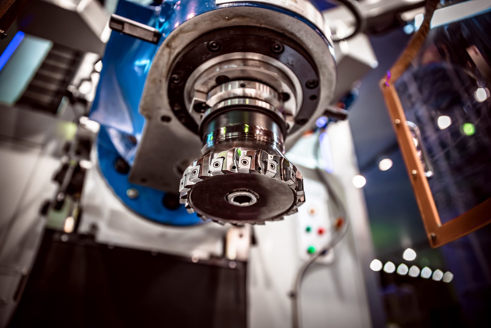 Metalworking CNC milling machine. Cutting metal modern processing technology. Small depth of field. Warning - authentic shooting in challenging conditions. A little bit grain and maybe blurred.